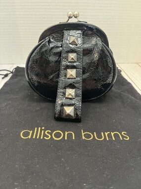 Allison Burns Deluxe patent leather wristlet.Silver studs. Kiss lock closure GUC
